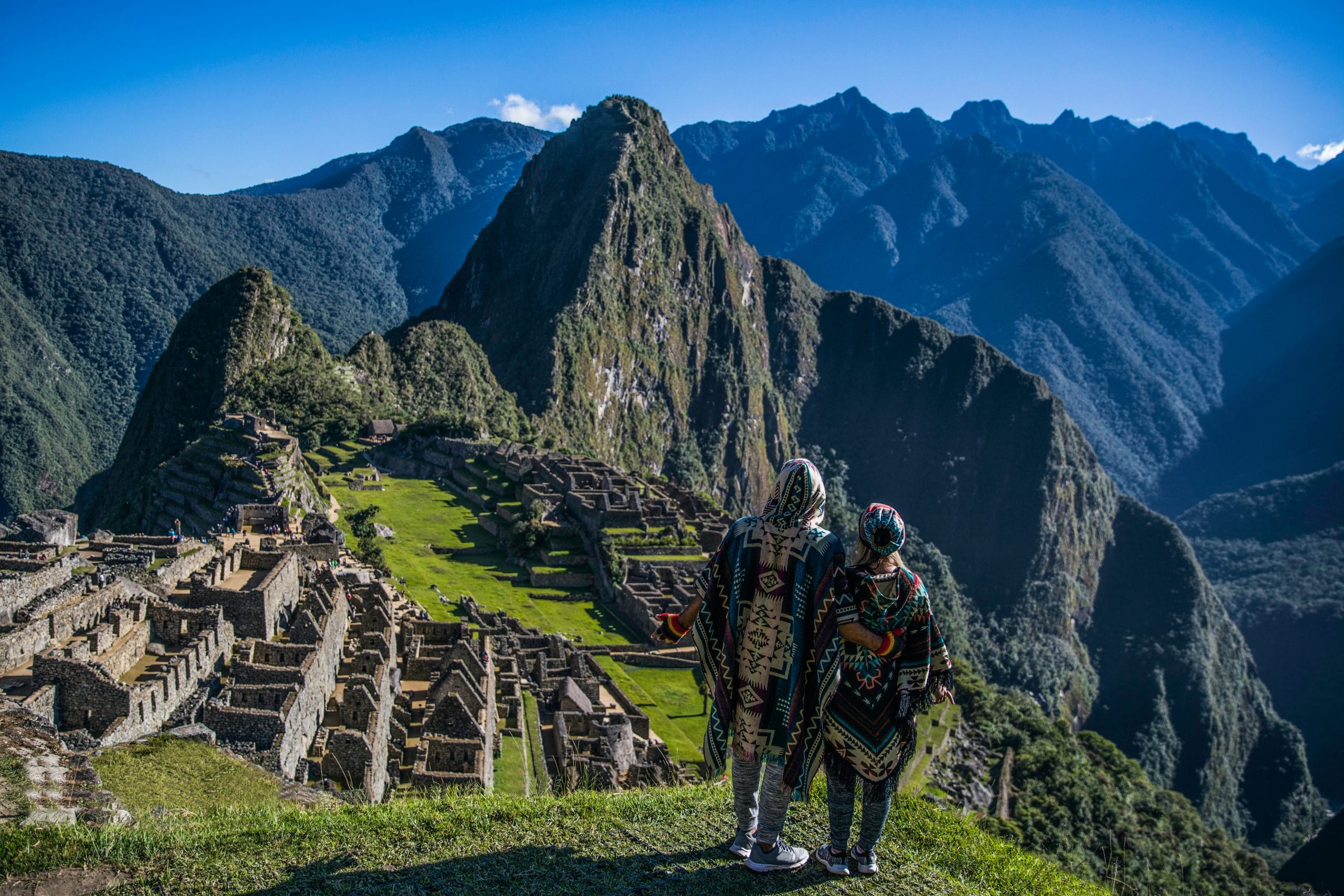 travellers looking over Machu Pichu in Peru